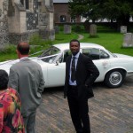 Jacques practices being Bond in front of "his" car.